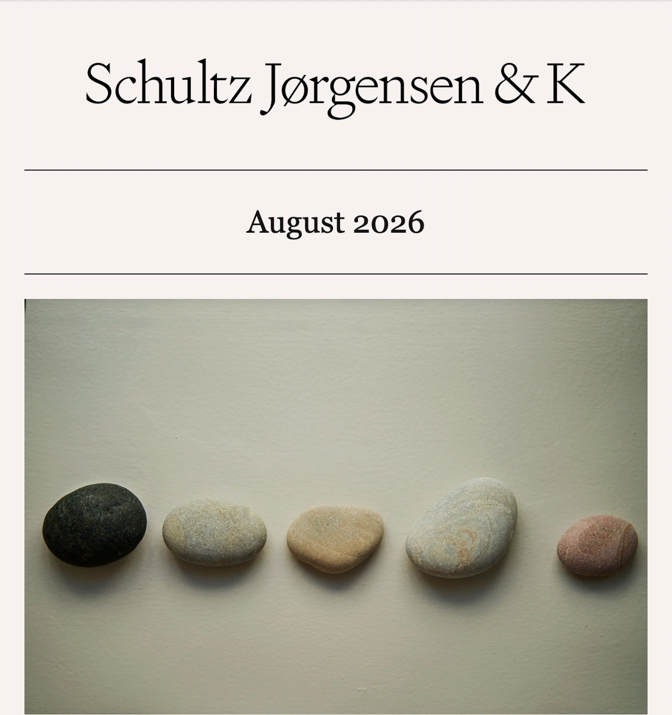SJ&K newsletter for August 2026 featuring five stones arranged in a row.