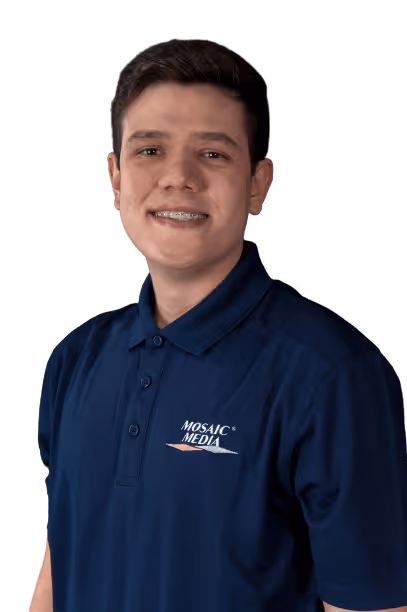 A man wearing a blue shirt with a logo on it.