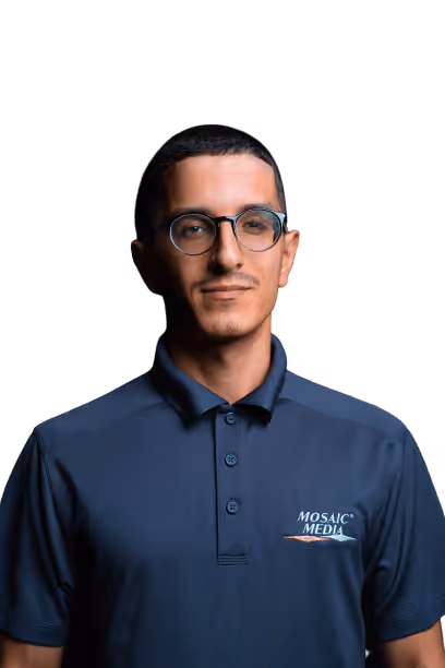 A man wearing glasses and a blue shirt with the word Nimbus Media on it.