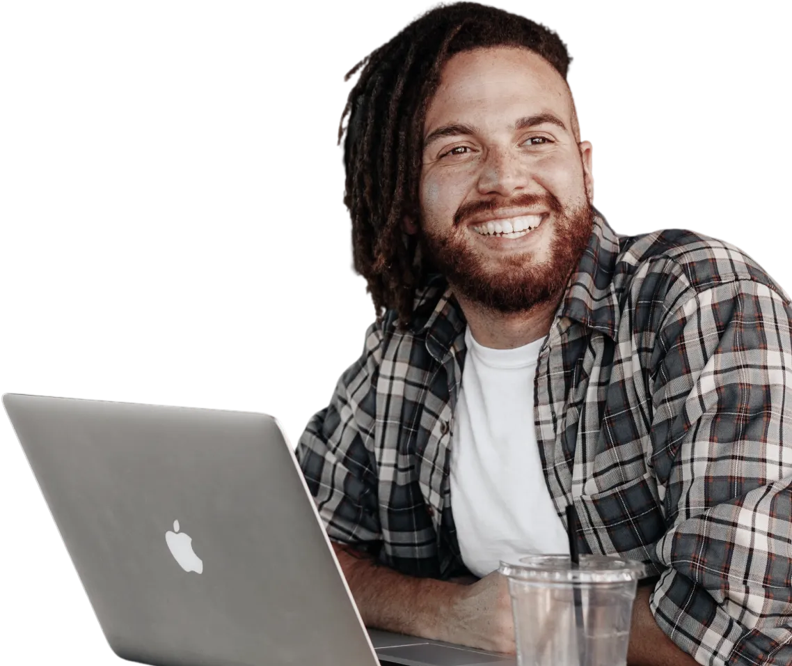 Man smiling at laptop