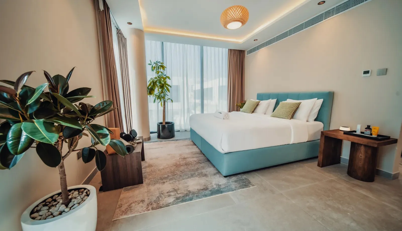 A bright private villa bedroom at Nas House