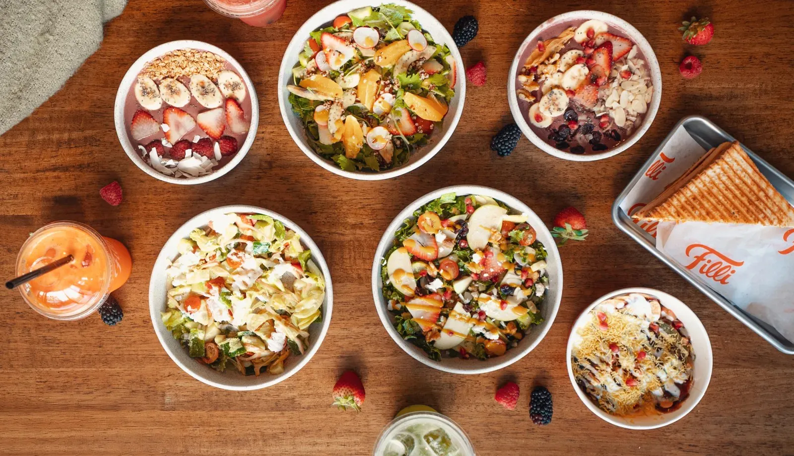 Colourful plant based bowls on a wooden table