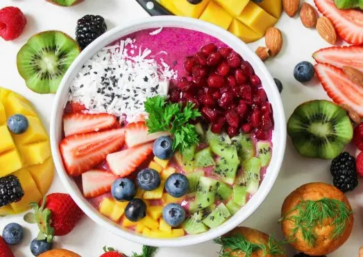 A colourful fruit and berry bowl