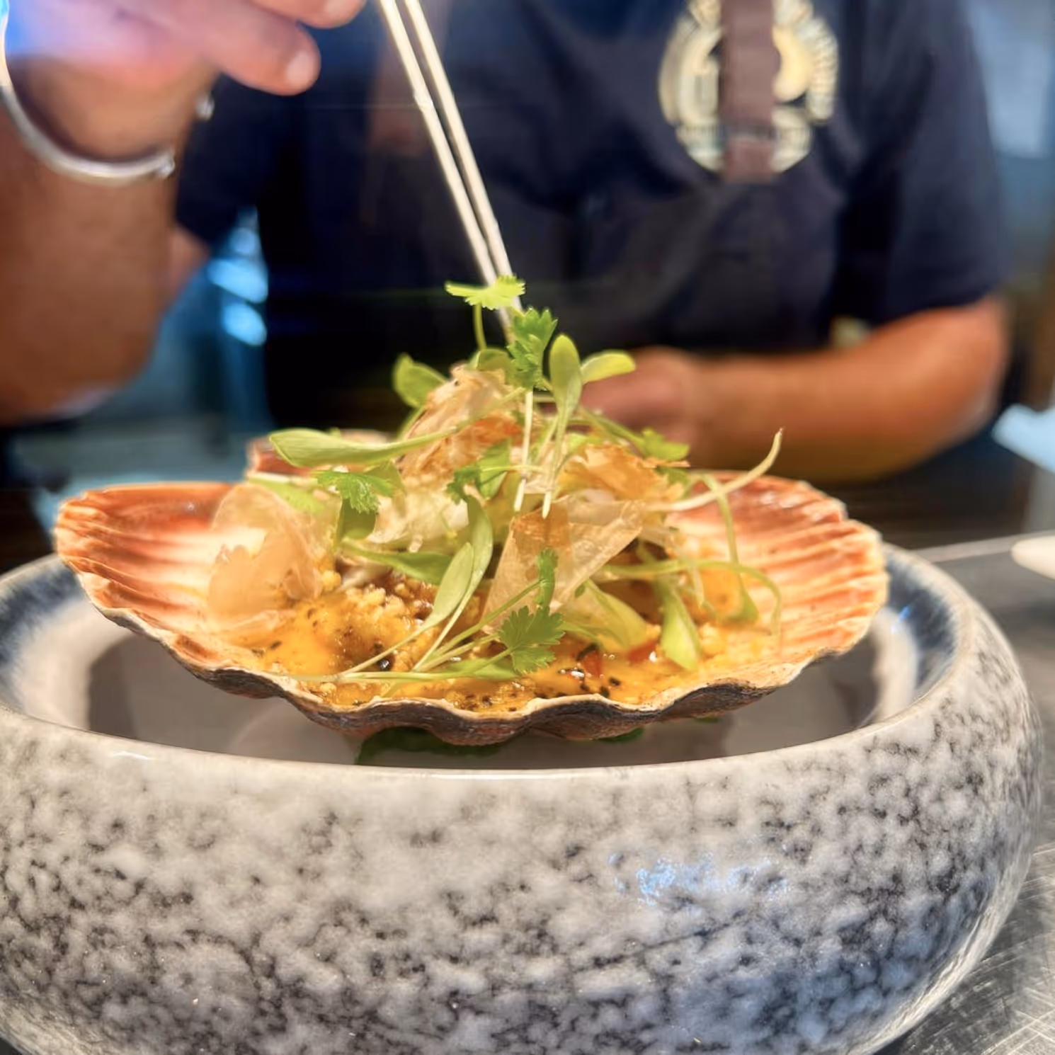 Serving a dish of scallops
