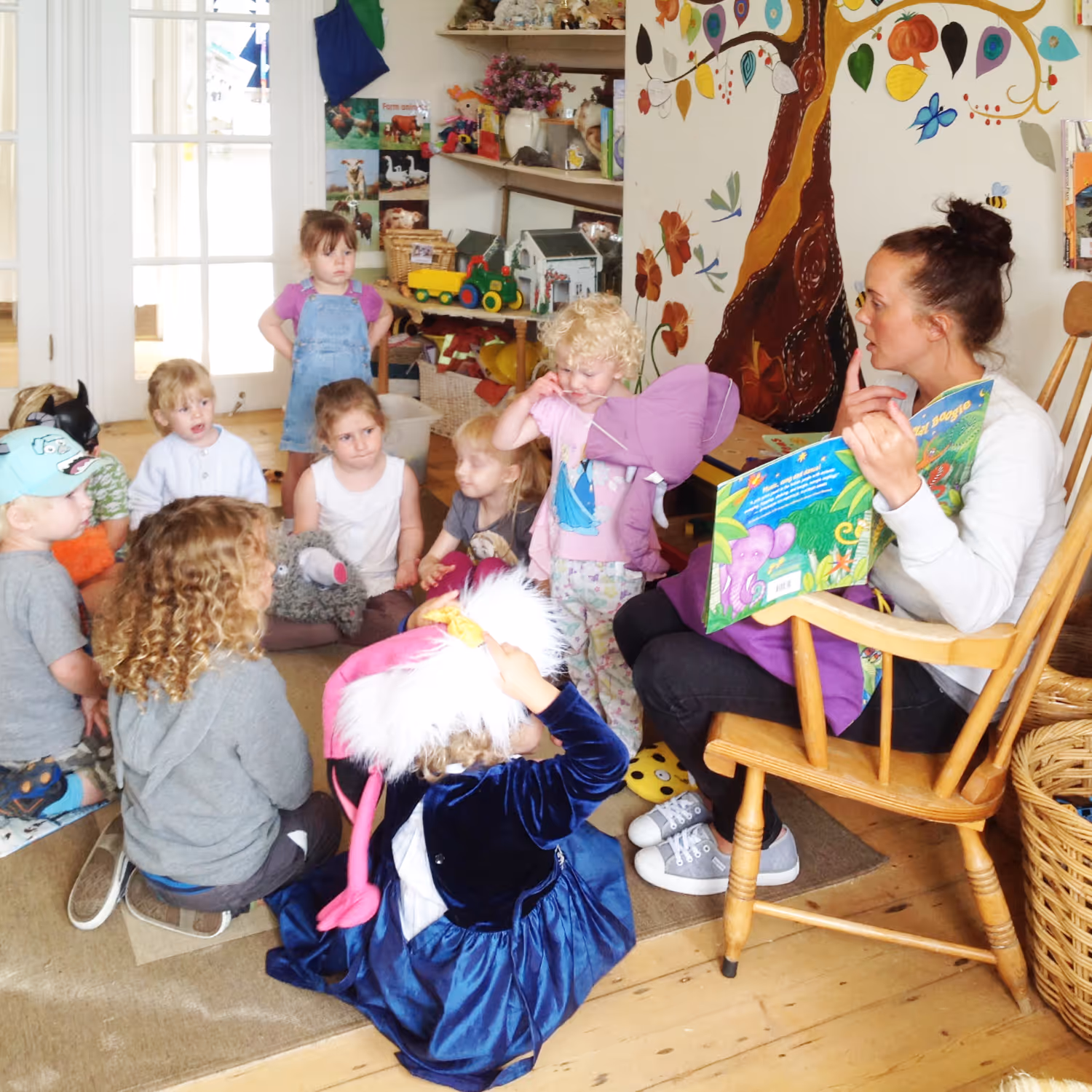 Teacher reading to young children