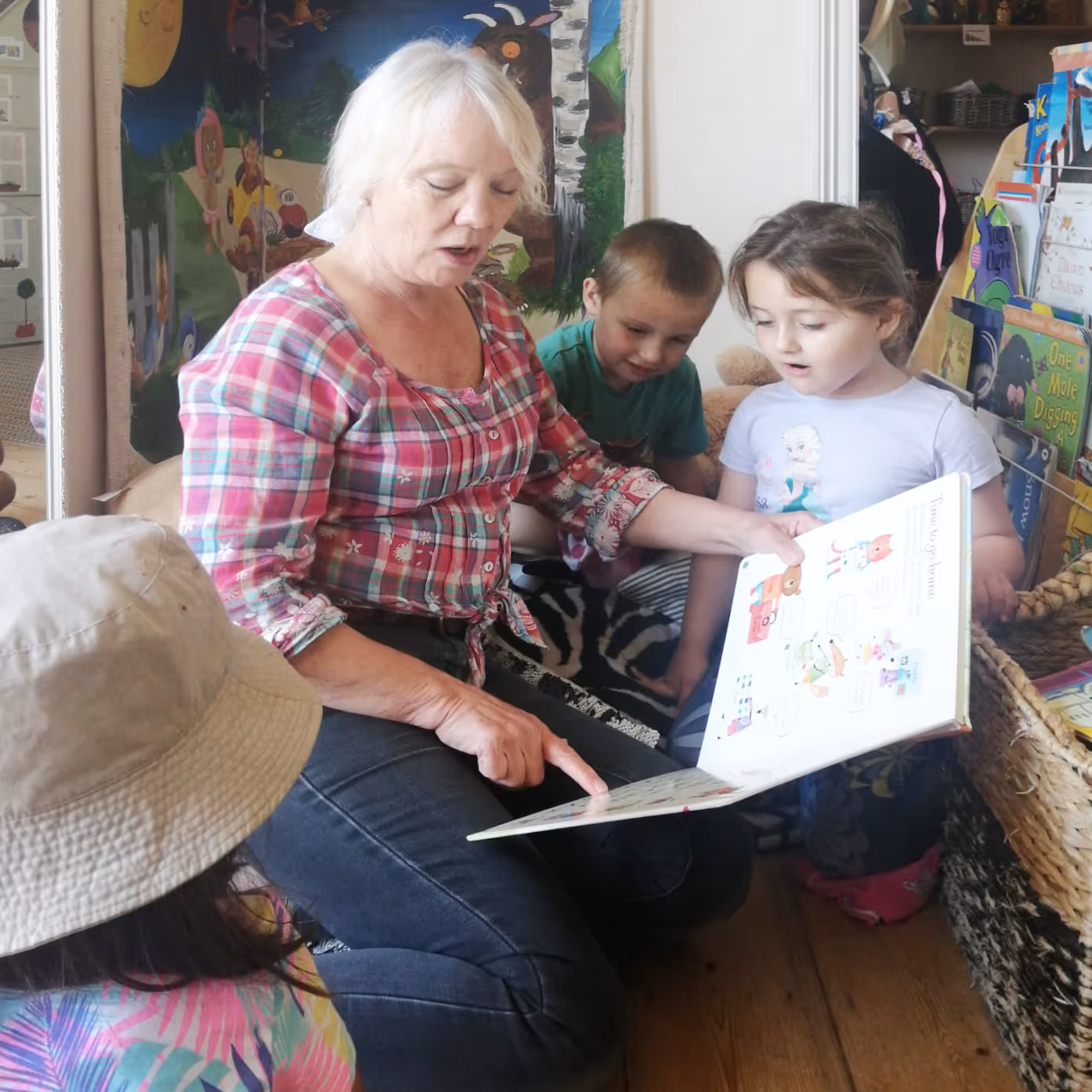 Teacher reading to young children
