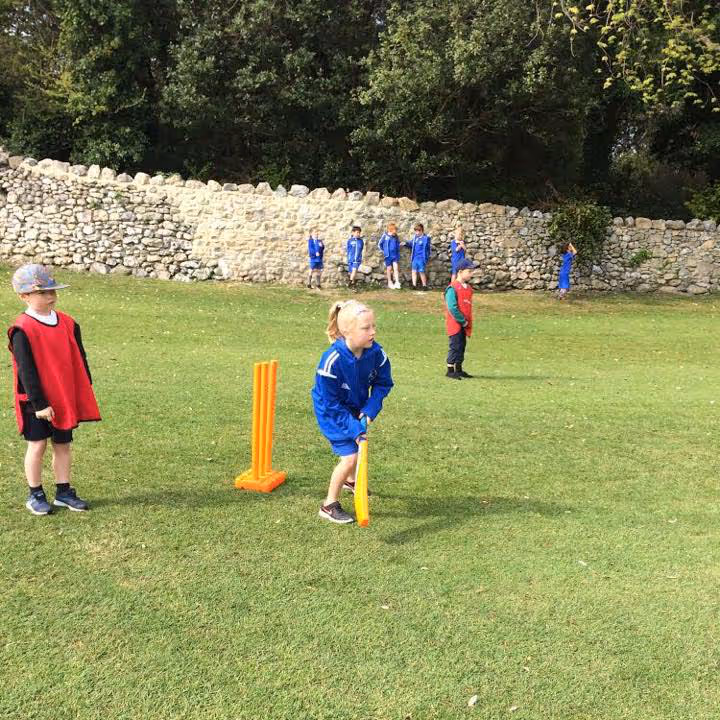 Kids playing cricket