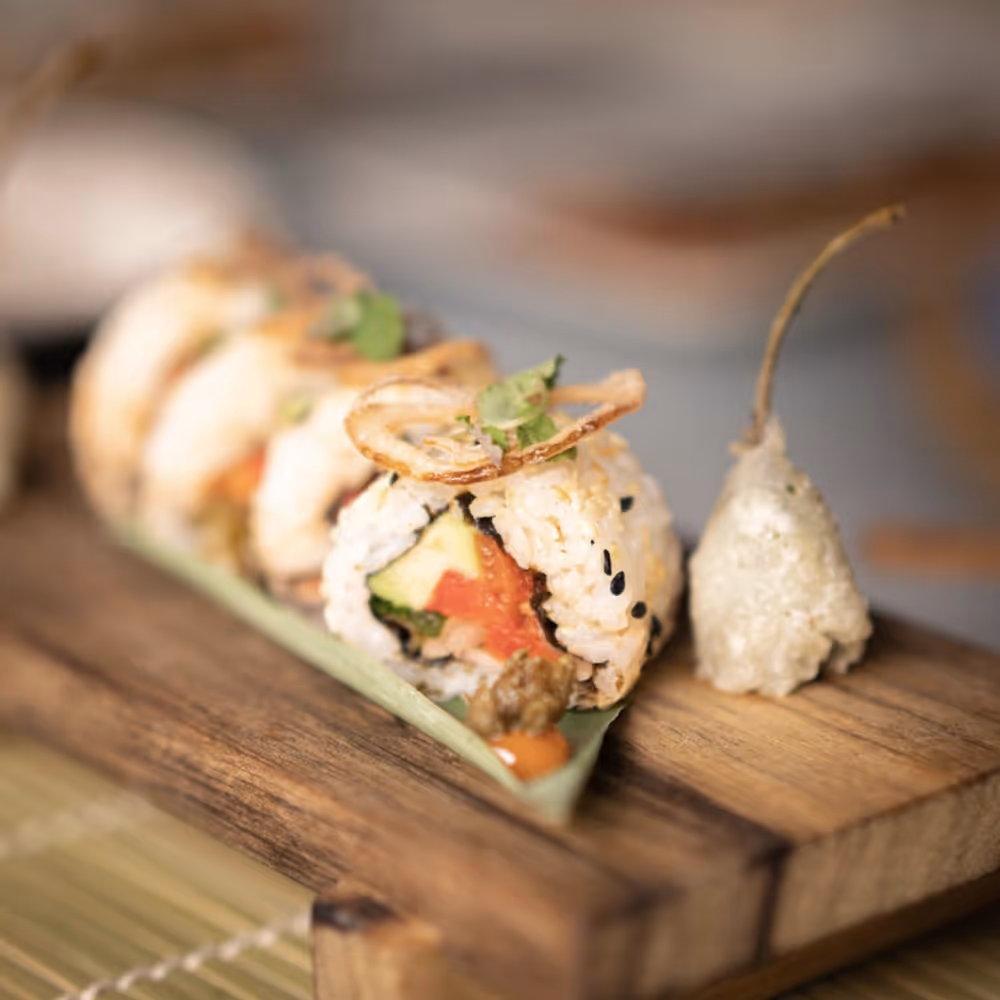 Wooden board with sushi