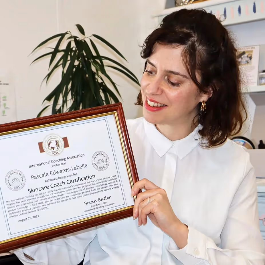 Lady holding up an award certificate