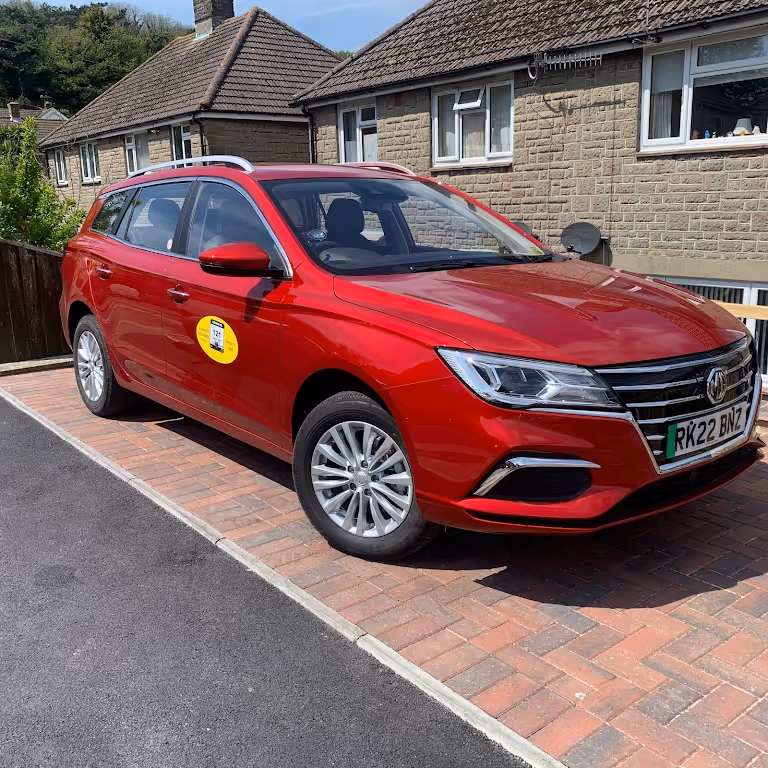 Red MG estate car