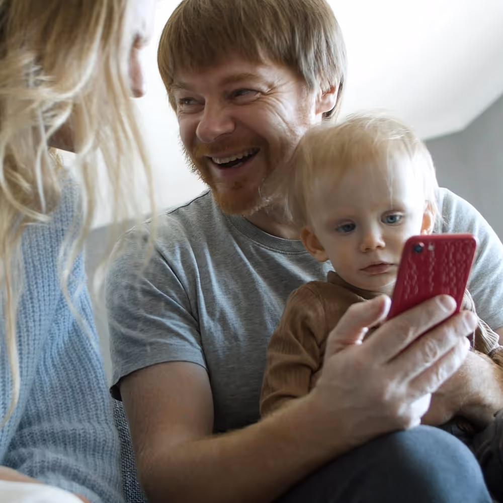 A man and woman with a young child
