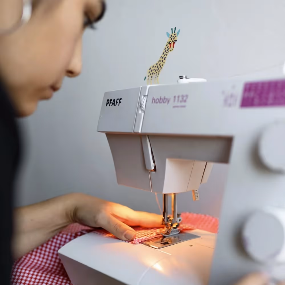 Lady using a sewing machine