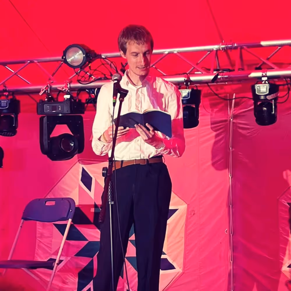 Man speaking on a stage