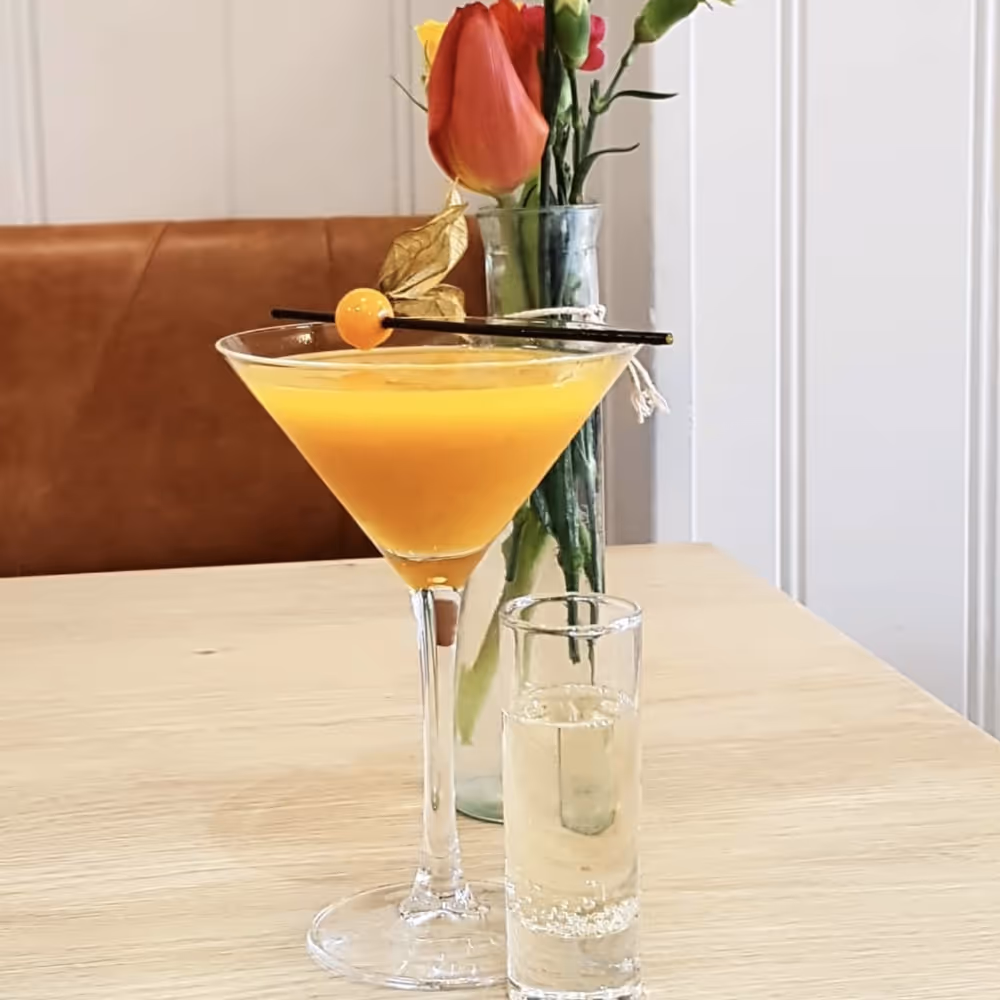 An orange based cocktail