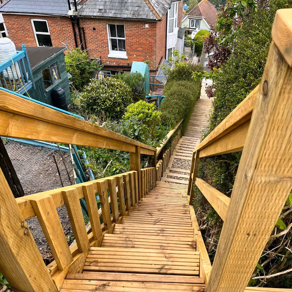 Steep wooden steps leading down to a house