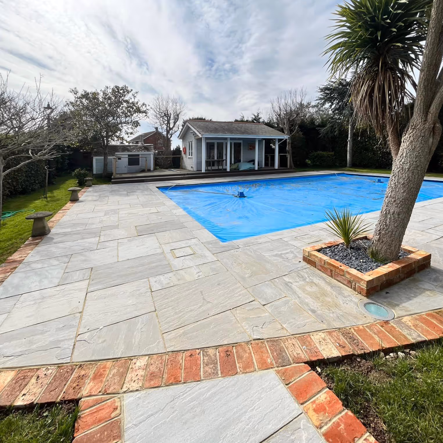 Newly paved area around an outdoor swimming pool