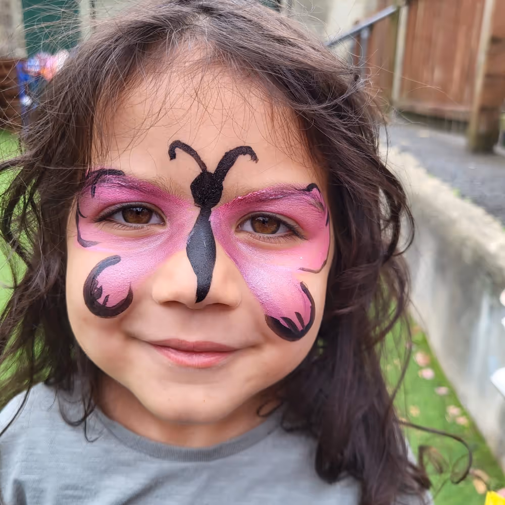 Girl with a face painted butterfly