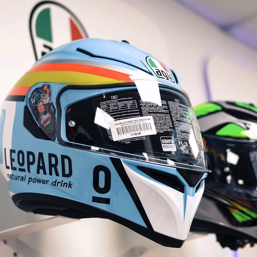 Aqua motorcycle helmet with red and yellow stripes