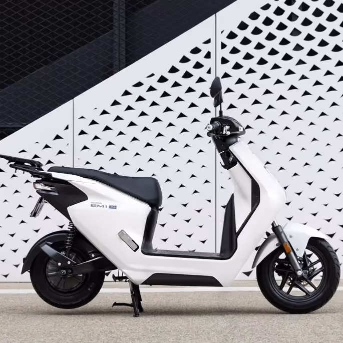 A white Honda SH Mode 125cc scooter