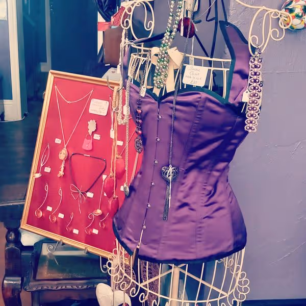 A purple silk corset on a mannequin
