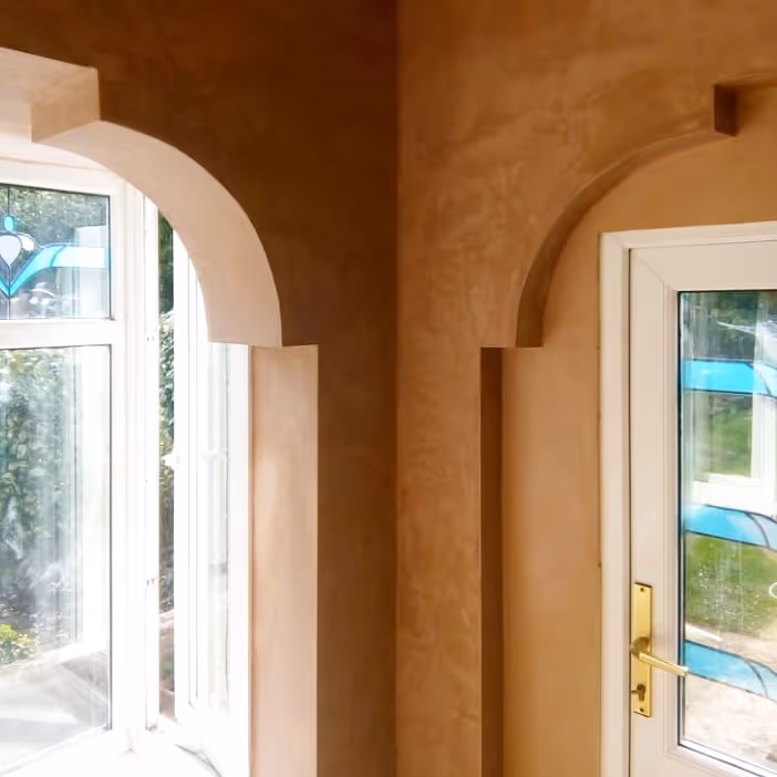 Newly plastered arched window reveals