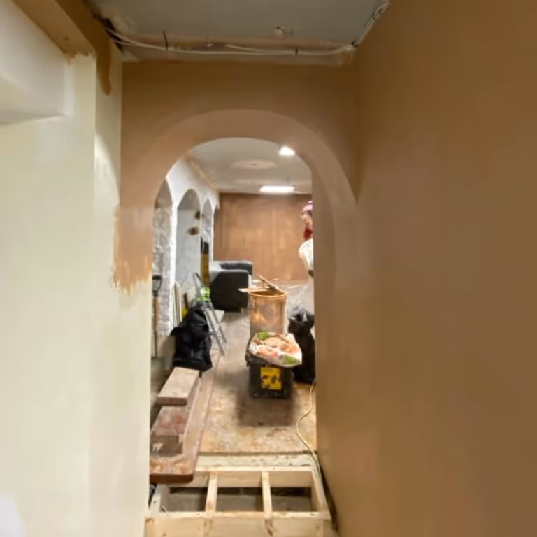 An archway being plastered