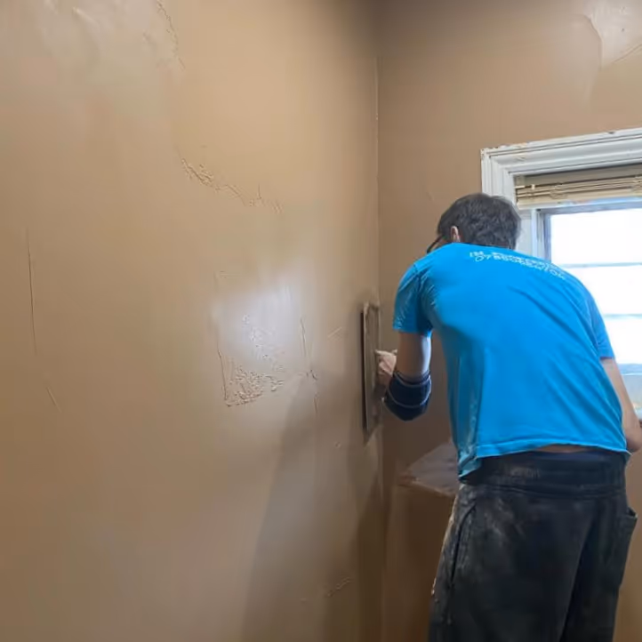 A man plastering a wall