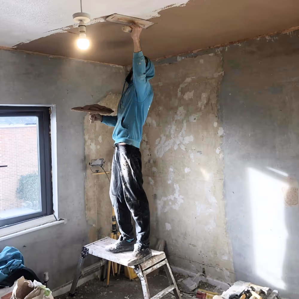 Man plastering a ceiling