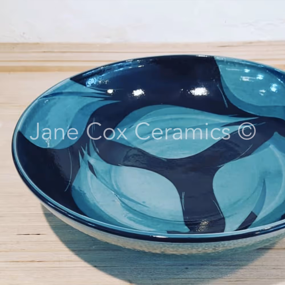 A large turquoise and blue ceramic bowl