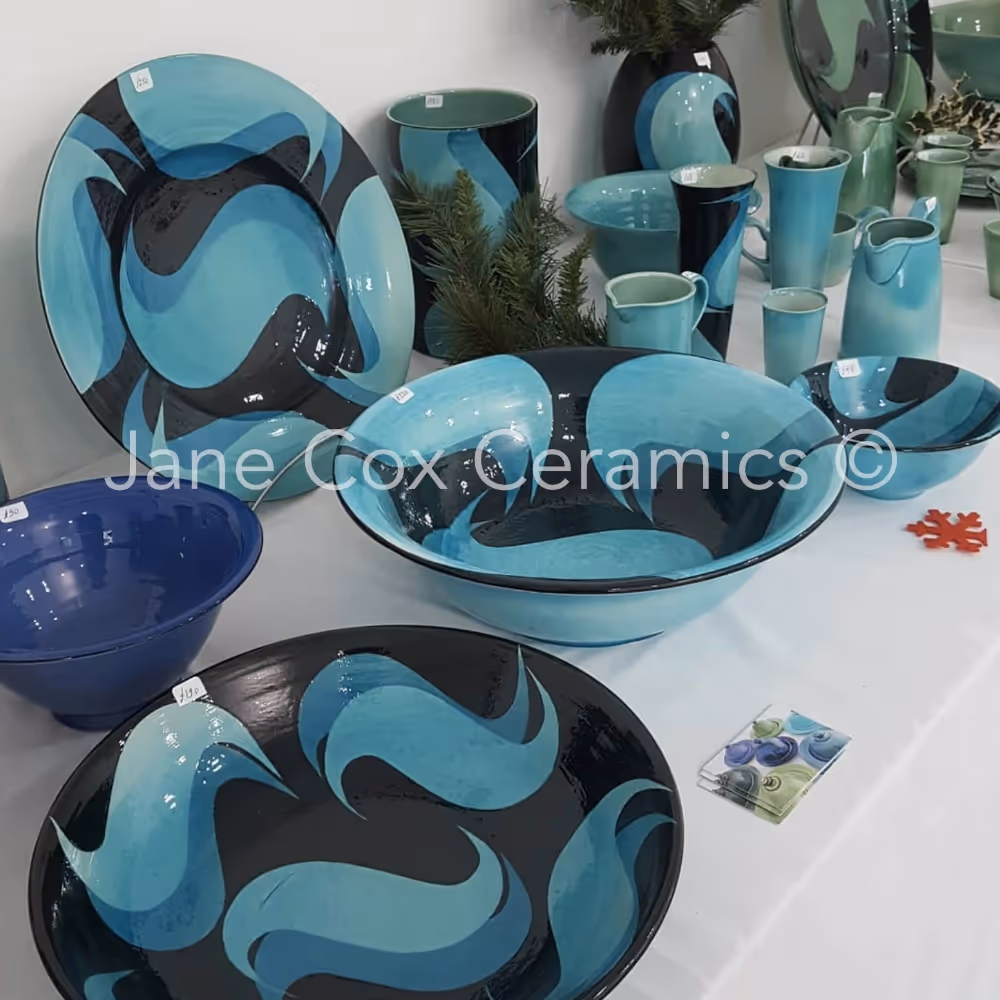 Selection of turquoise and black ceramics bowls and vases