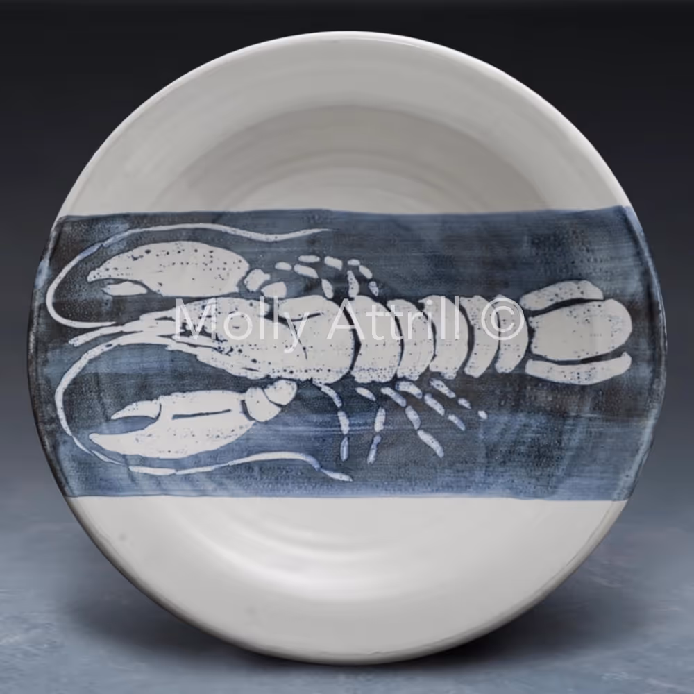 A blue and white bowl with a lobster design