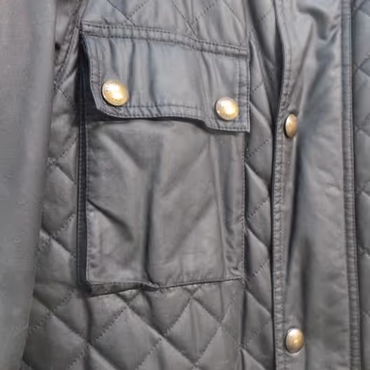 Pocket of a black quilted jacket