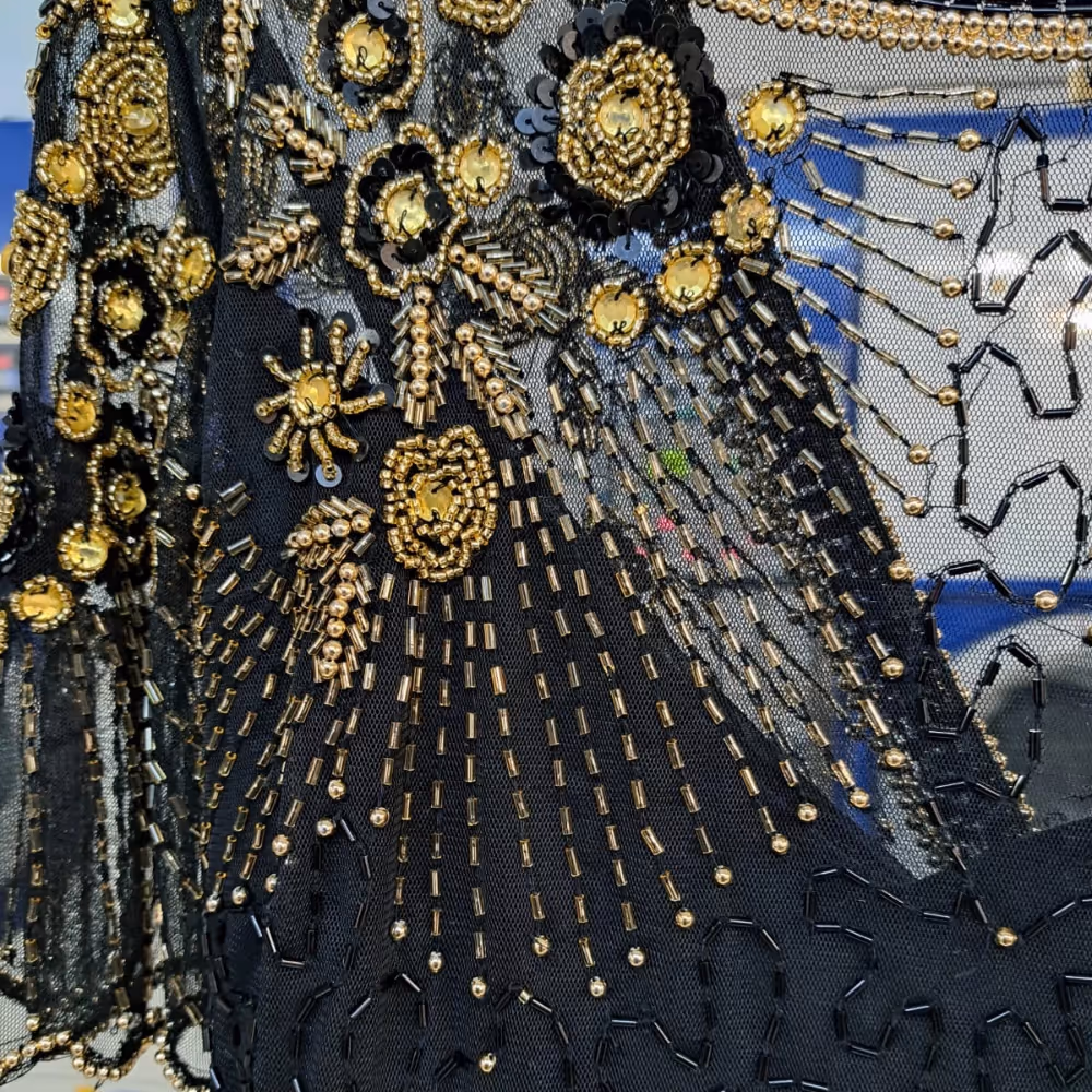 Closeup of delicate beading on an evening dress