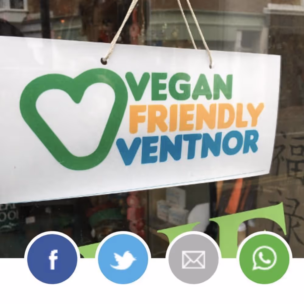 A hanging sign in a shop window