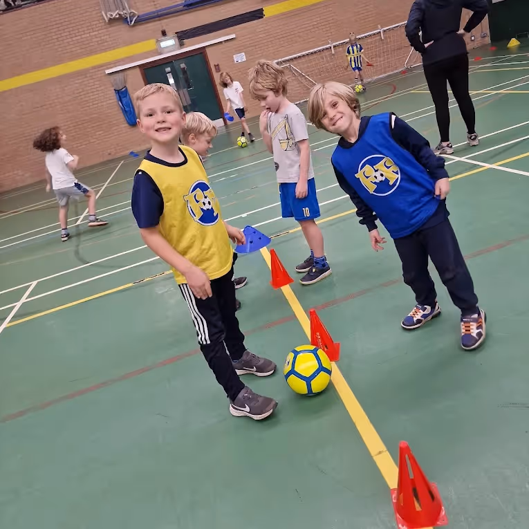 Kids playing indoor football