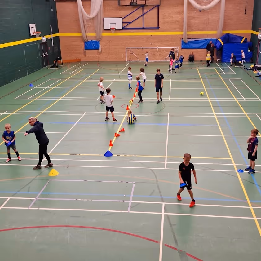 Kids playing indoor football