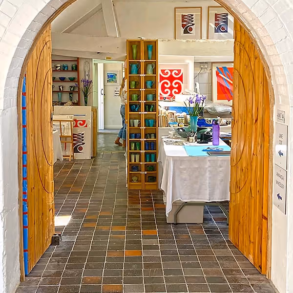 Arched doorway through to an art gallery