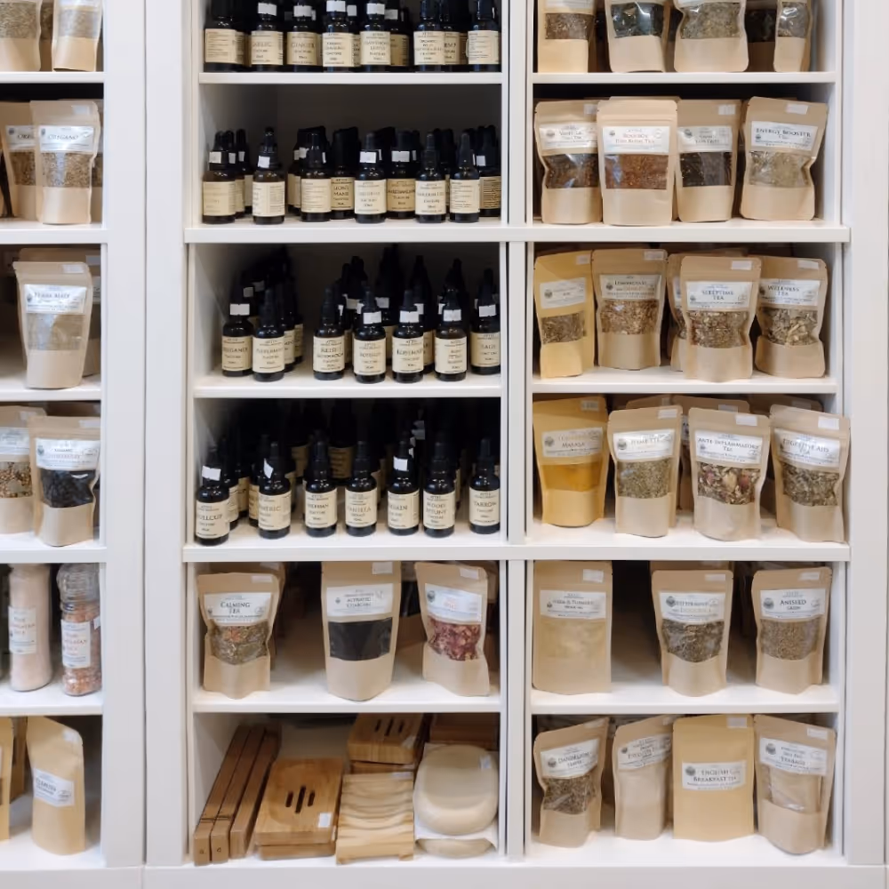 Shelves in a shop displaying teas, herbs and spices