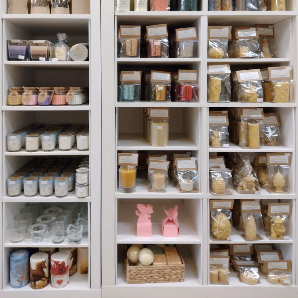 shelves in a shop displaying candles and soaps