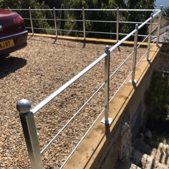 Metal railings around a driveway