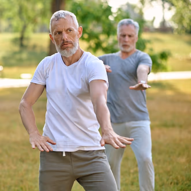 Two men practising Qigong