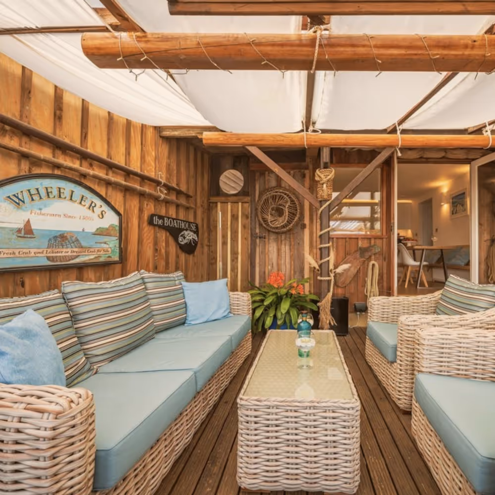 An outside space of a wooden beach side holiday home