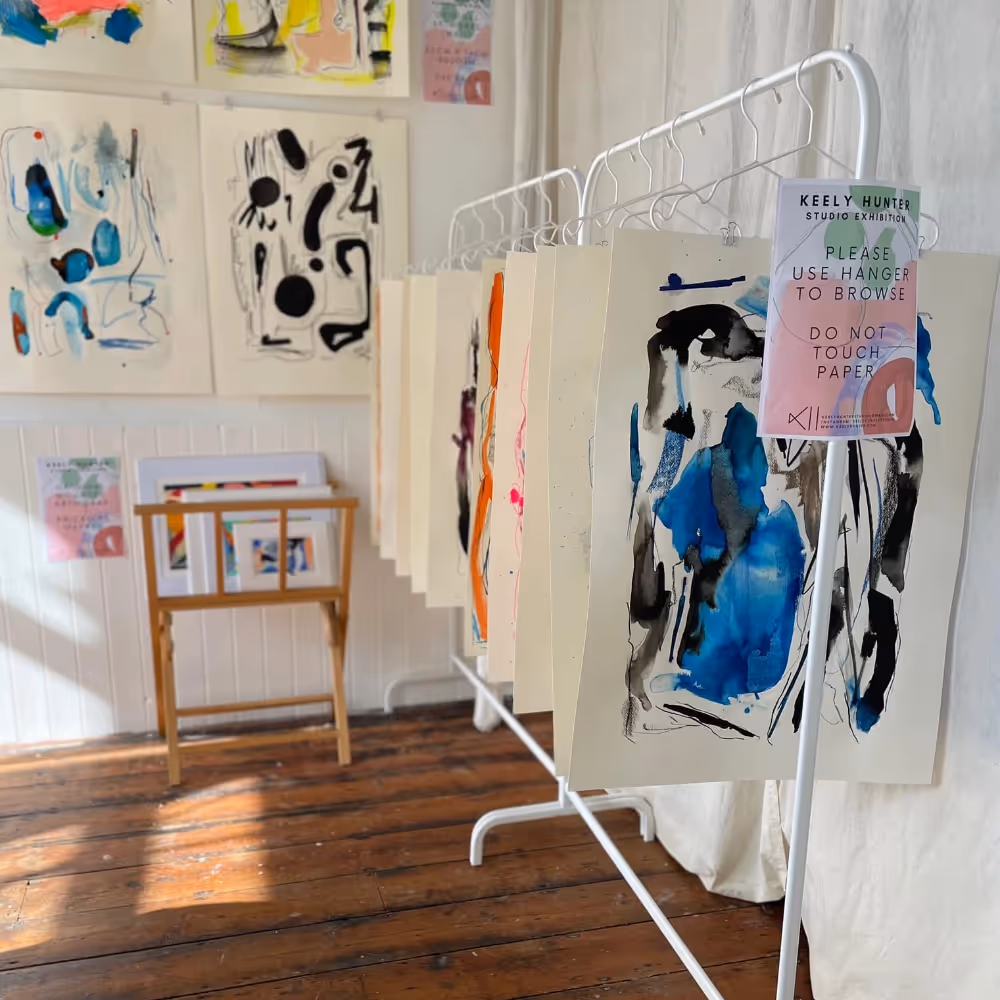 A display of watercolour paintings in a gallery