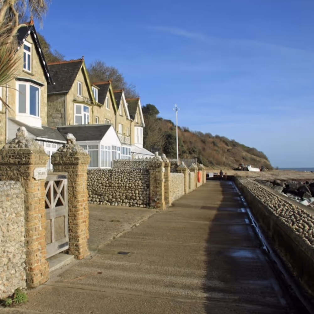 A row of houses right next to a beach