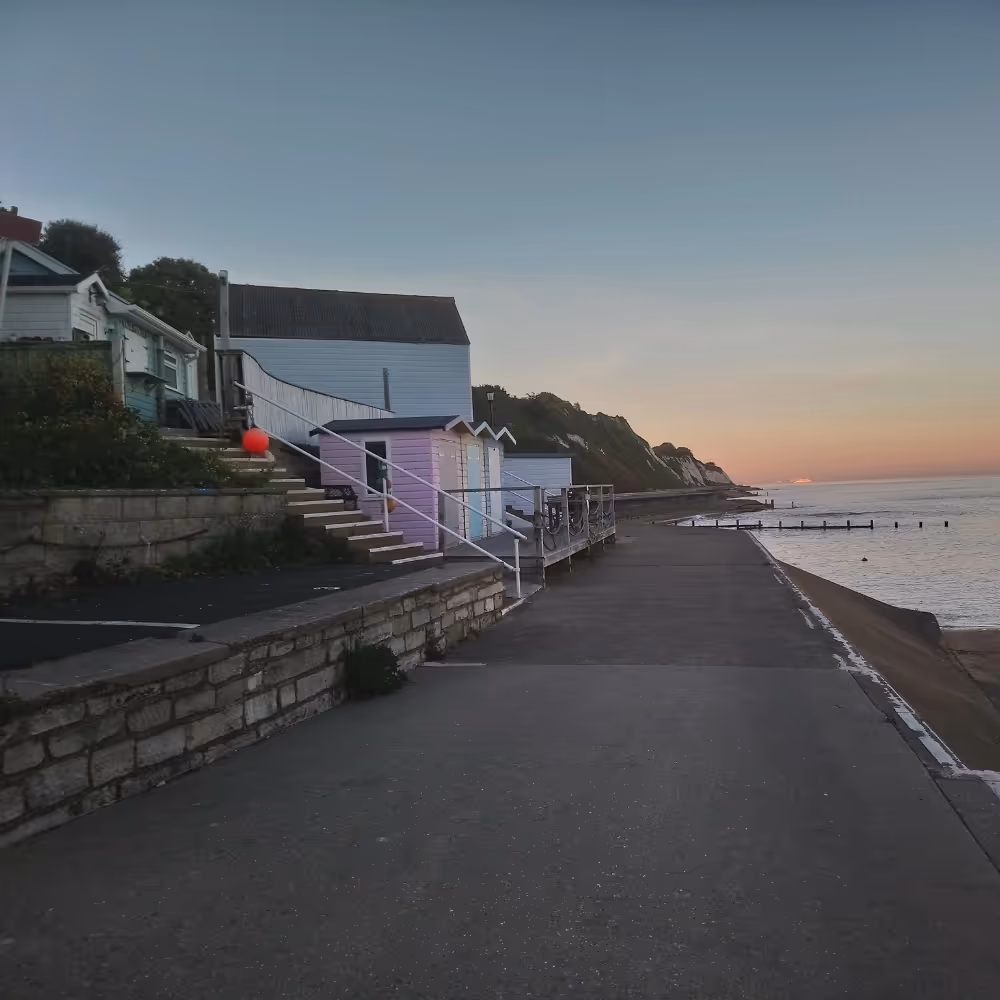 Looking east towards a colourful sunrise over the esplande and sea