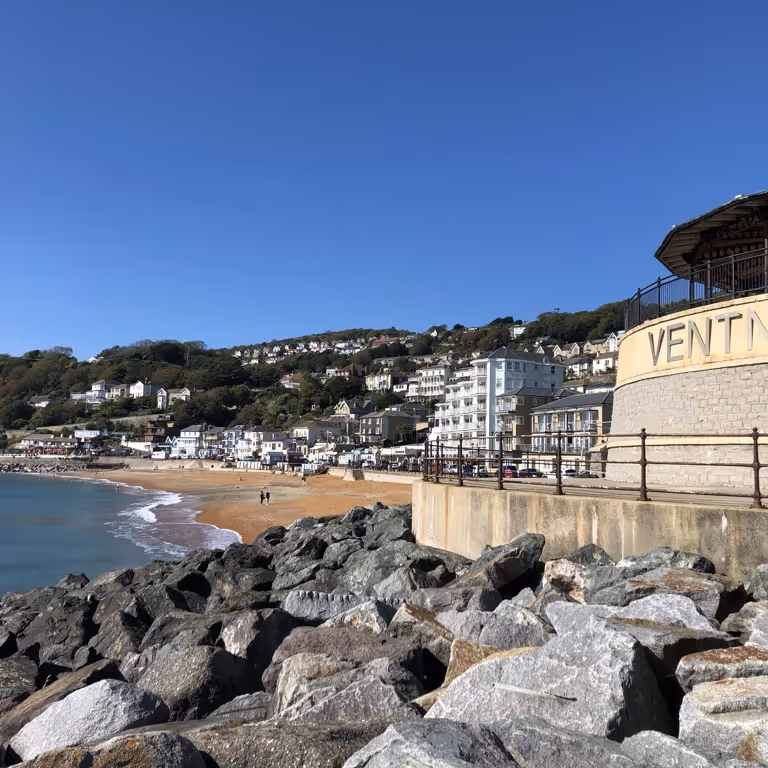 Looking across to a sea from from a rocky spit