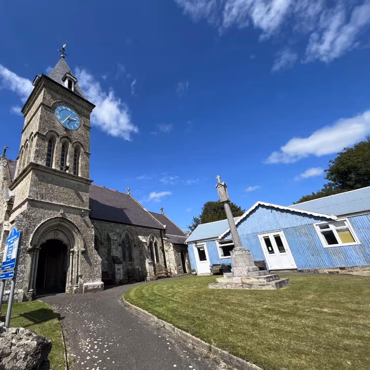 An old church with a tin church hall beside it