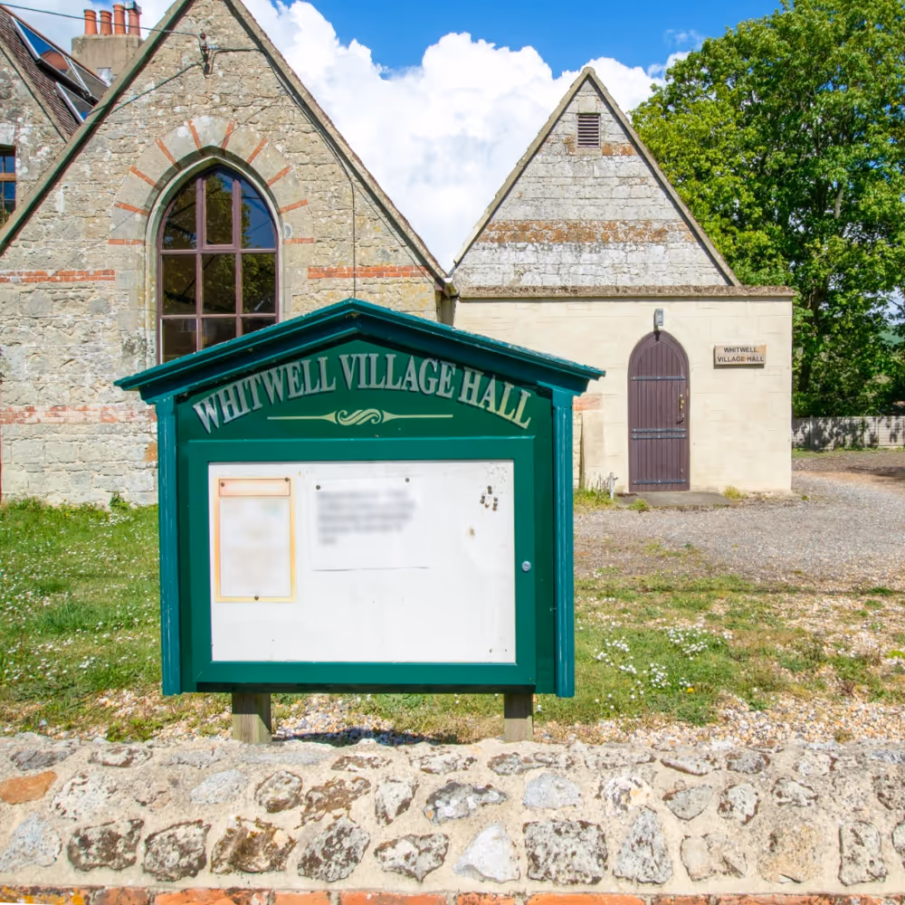 A notice board outside a village hall