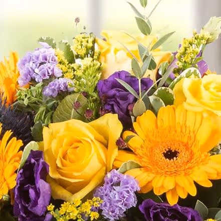 A bouquet of purple and yellow flowers