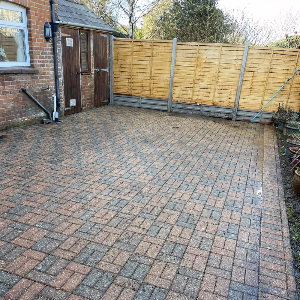 A driveway that's being pressure washed